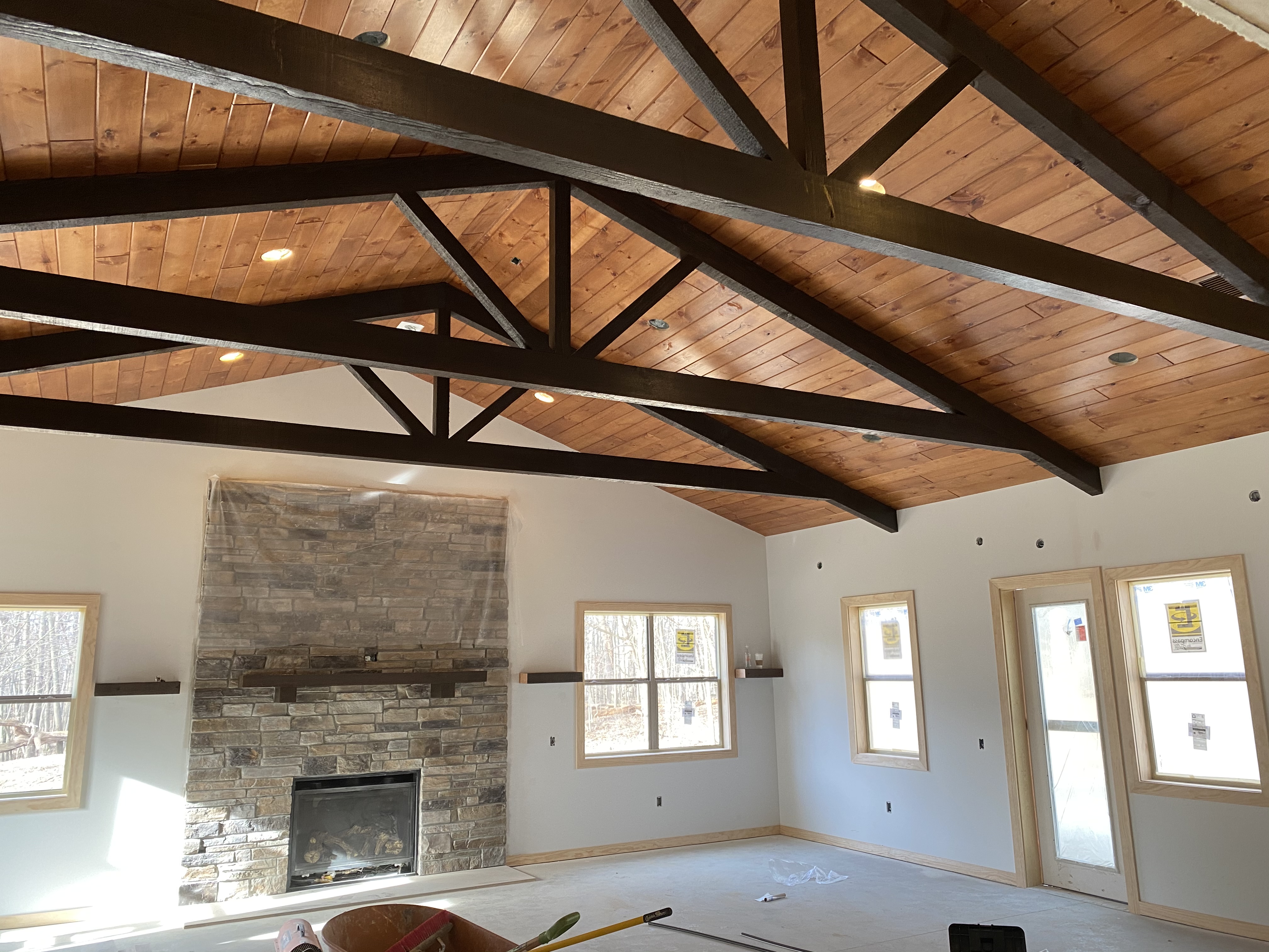 King post interior trusses stained dark walnut. Timber truss manufacturers