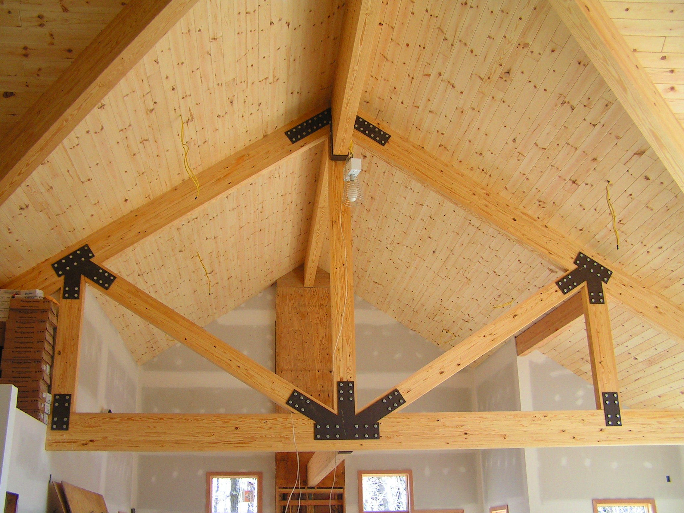 Interior queen post truss example. Timber truss manufacturers
